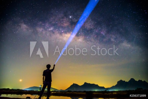 Picture of The man Shining the torch to milky way  Milky way with lighting
